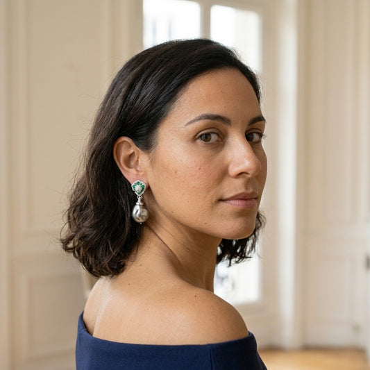 Model wearing the Baroque Vert Drop Earrings, silver-tone brass, simulated baroque pearls, simulated emeralds, simulated diamonds