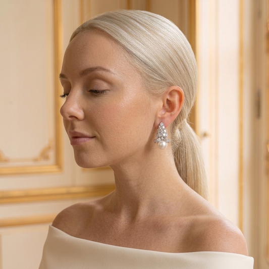 Model wearing the Grappe Stud Earrings, silver-tone brass, simulated pearls, simulated diamonds