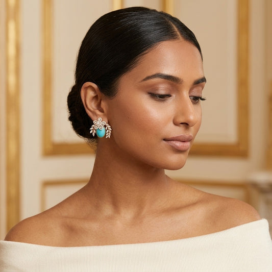 Model wearing the Laurier Stud Earrings, gold-tone brass, simulated turquoise, simulated diamonds