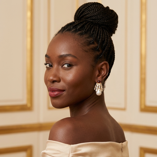 Model wearing the Lustre Drop Earrings, gold-tone brass, simulated garnets, simulated pearls, simulated diamonds