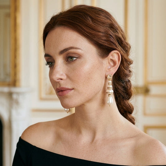 Model wearing the Pagode Drop Earrings, gold-tone brass, simulated pearls, simulated diamonds