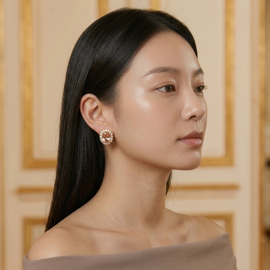 Model wearing the Rosée Halo Stud Earrings, gold-tone brass, simulated morganites, simulated diamonds
