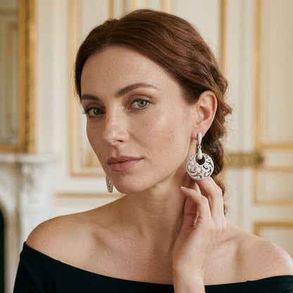Model wearing the Arabesque Disc Earrings, silver-tone brass, simulated diamonds