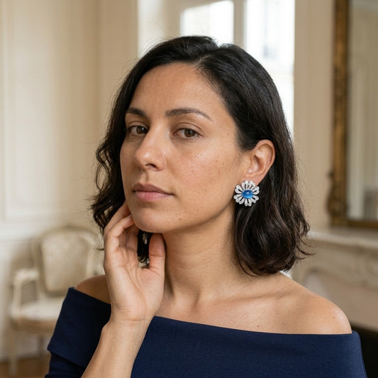 Model wearing the Bleuet Stud Earrings, silver-tone brass, blue cabochons, simulated diamonds