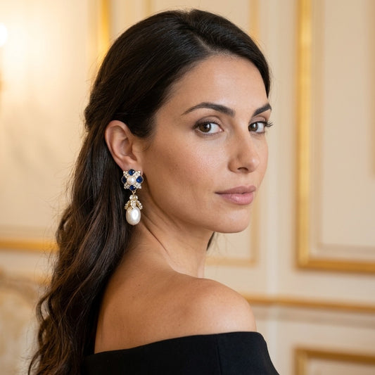 Model wearing the Byzance Drop Earrings, gold-tone brass, simulated sapphires, simulated pearls, simulated diamonds