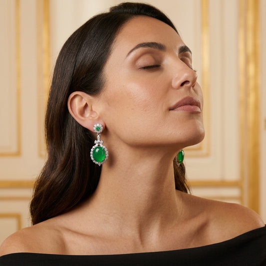 Model wearing the Céladon Drop Earrings, silver-tone brass, simulated jade, simulated emeralds, simulated diamonds