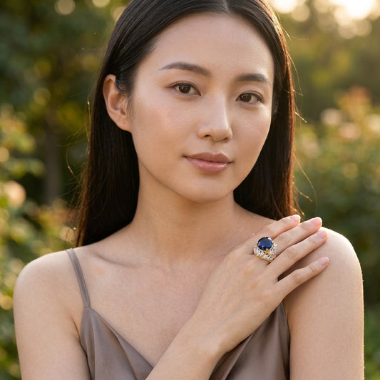 Model wearing the Couronne Cocktail Ring, two-tone brass, simulated sapphire, simulated diamonds