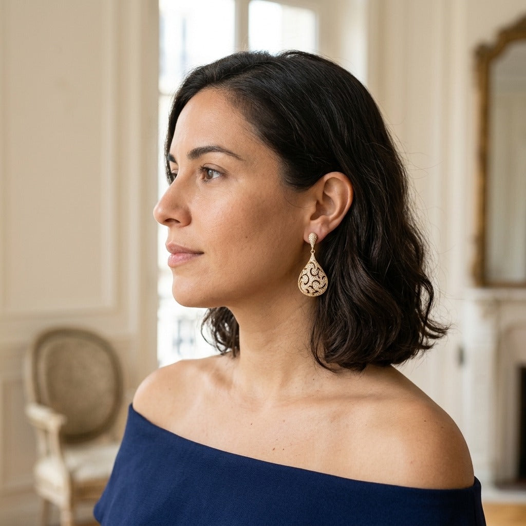 Model wearing the Dentelle Teardrop Earrings, gold-tone brass, simulated diamonds