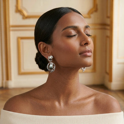 Model wearing the Guirlande Drop Earrings, silver-tone brass, simulated grey pearls, simulated diamonds