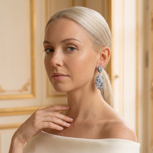 Model wearing the Lagune Drop Earrings, silver-tone brass, simulated aquamarines, simulated sapphires, simulated diamonds