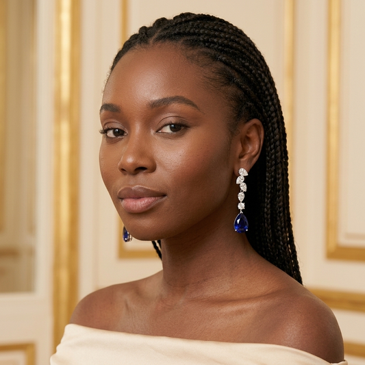 Model wearing the Larme Line Earrings, silver-tone brass, simulated sapphires, simulated diamonds