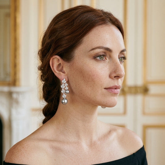 Model wearing the Laurier Vine Earrings, silver-tone brass, simulated grey pearls, simulated diamonds