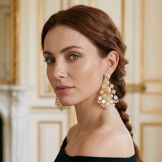 Model wearing the Médaille Chandelier Earrings, gold-tone brass, pearlescent discs, simulated seed pearls