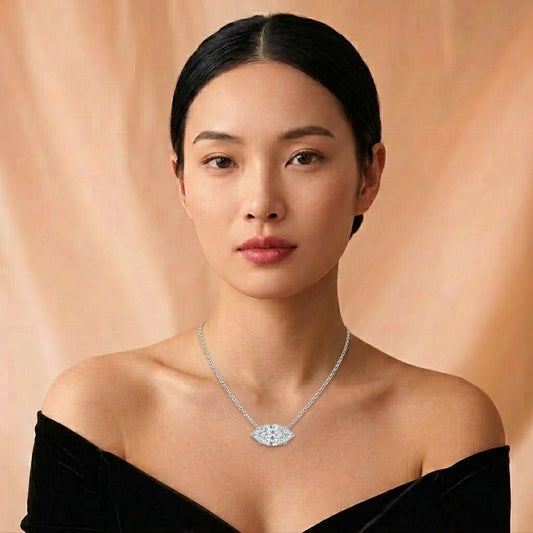 Model wearing the Navette Pendant, an east-west marquise lab-grown diamond in 18K white gold