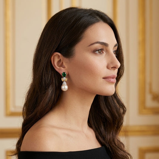 Model wearing the Nœud Vert Drop Earrings, silver-tone brass, simulated emeralds, simulated yellow sapphires, simulated pearls, simulated diamonds