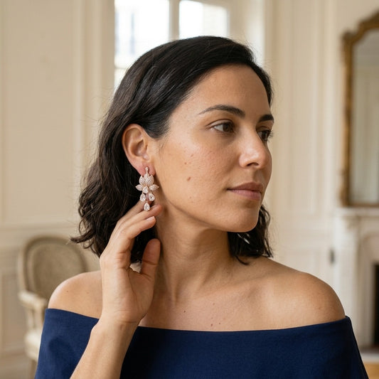 Model wearing the Nymphéa Drop Earrings, rose gold-tone brass, simulated diamonds