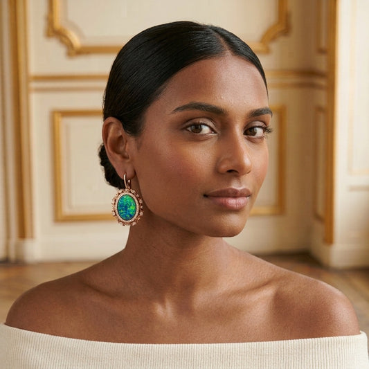 Model wearing the Opaline Halo Earrings, rose gold-tone brass, simulated opals, simulated diamonds