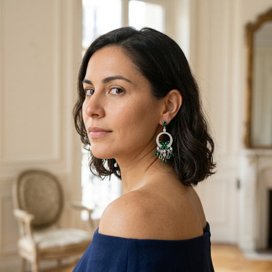 Model wearing the Papillon Chandelier Earrings, silver-tone brass, simulated emeralds, simulated diamonds
