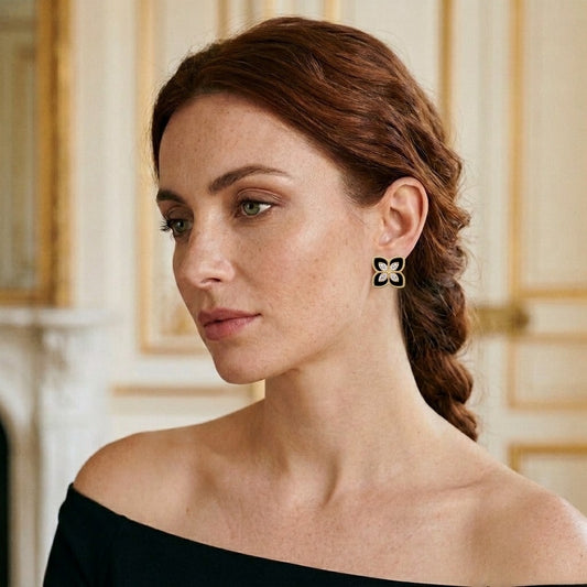 Model wearing the Pétale Stud Earrings, gold-tone brass, black enamel, simulated diamonds