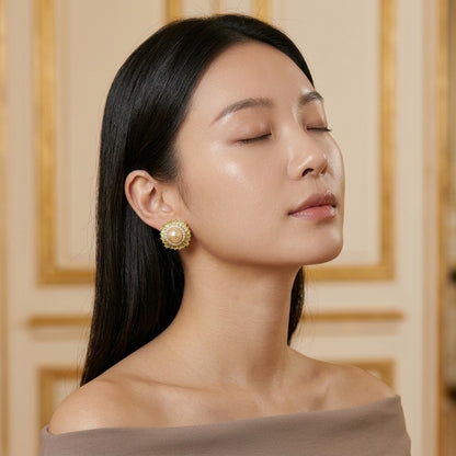 Model wearing the Soleil Stud Earrings, gold-tone brass, simulated golden pearls, simulated citrines